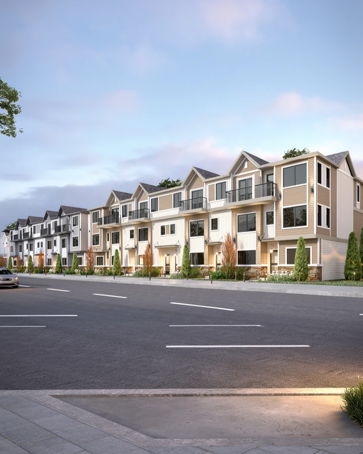 Continuous row of multifamily townhomes with coordinated frontage, balconies, landscaping, and street access